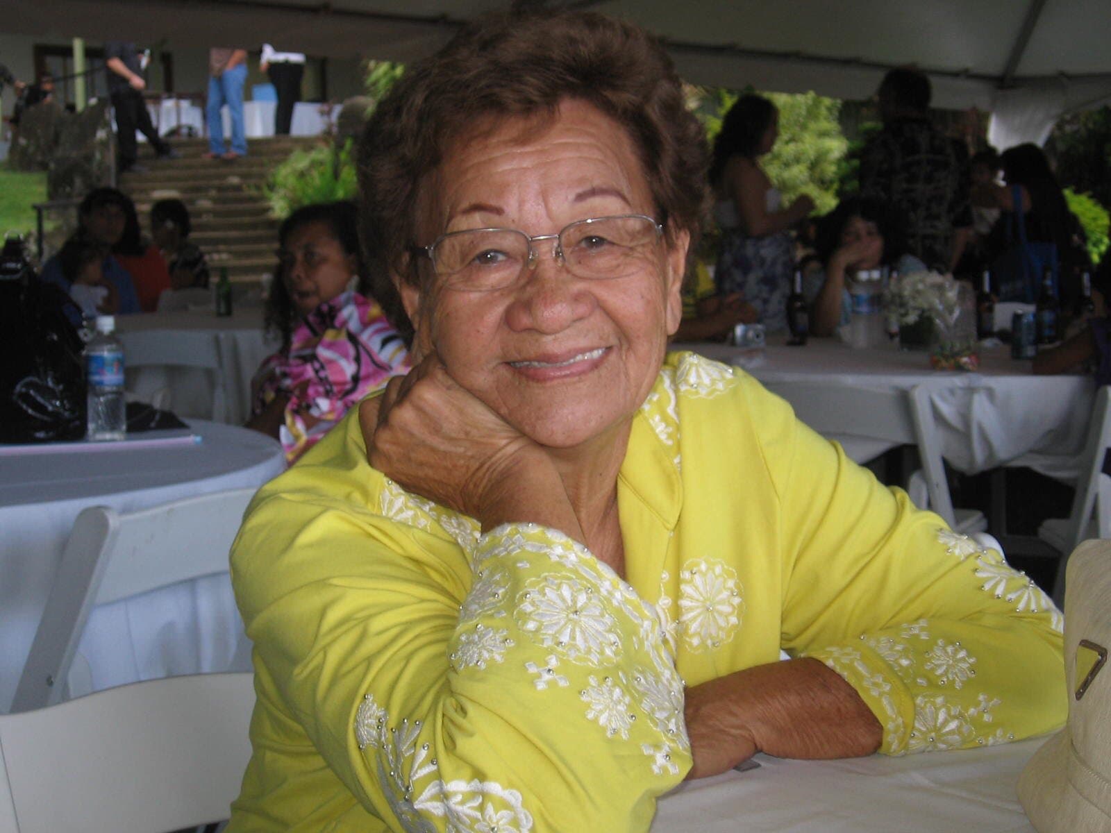 Nanna smiling in her yellow dress